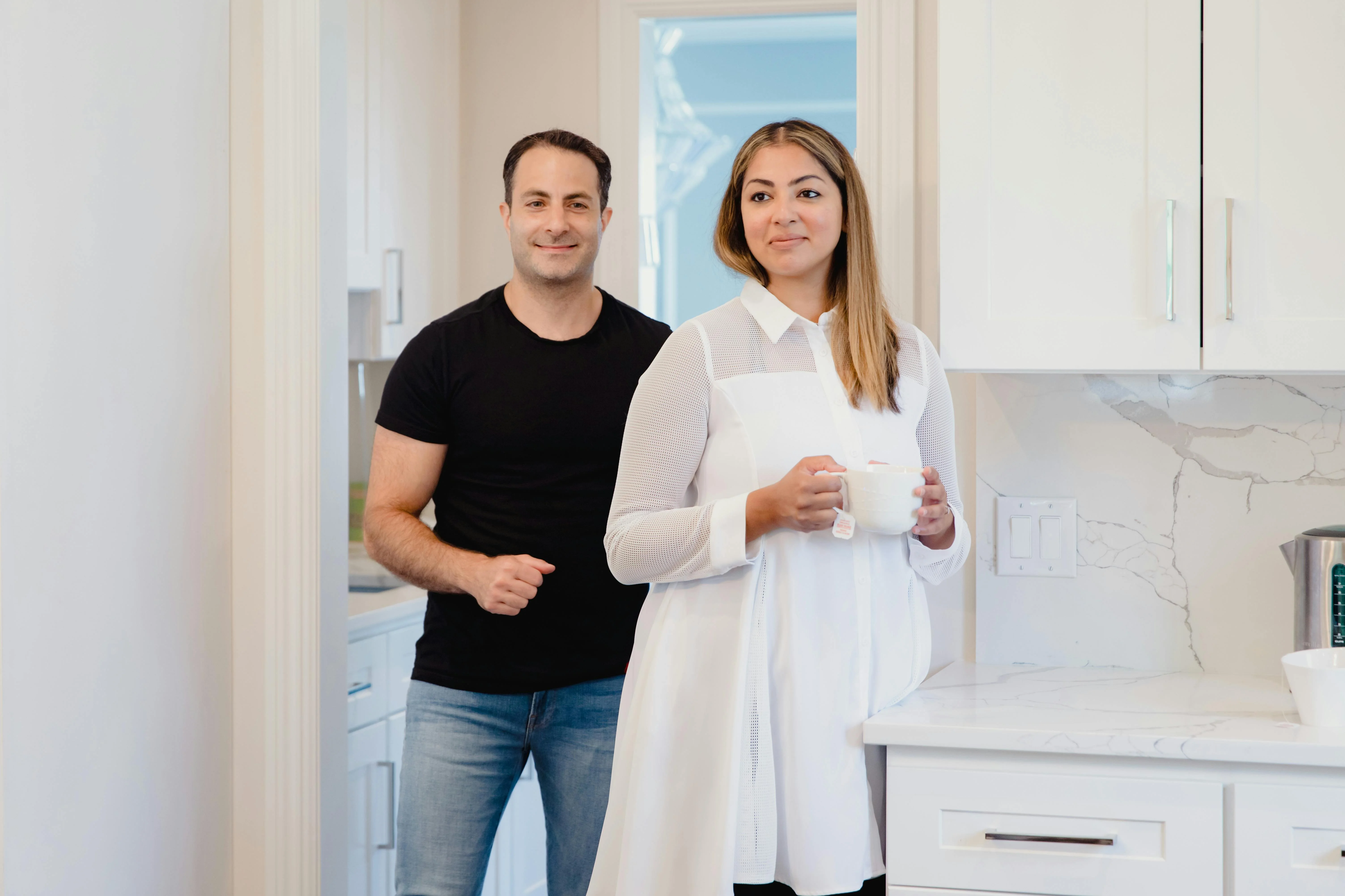 Before and after kitchen carousel, bright natural light, homeowner smiling